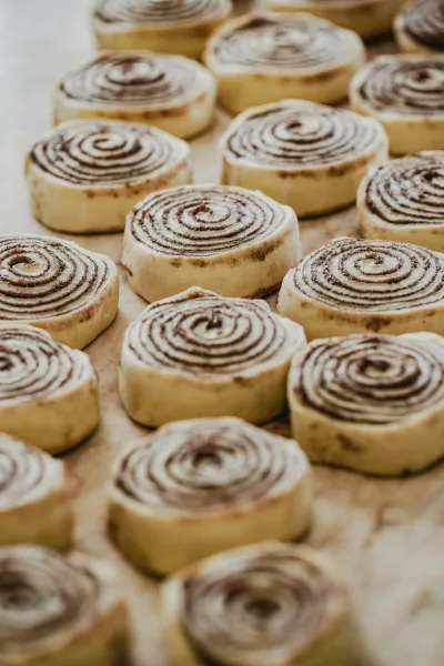 Cinnamon rolls rising in the pan